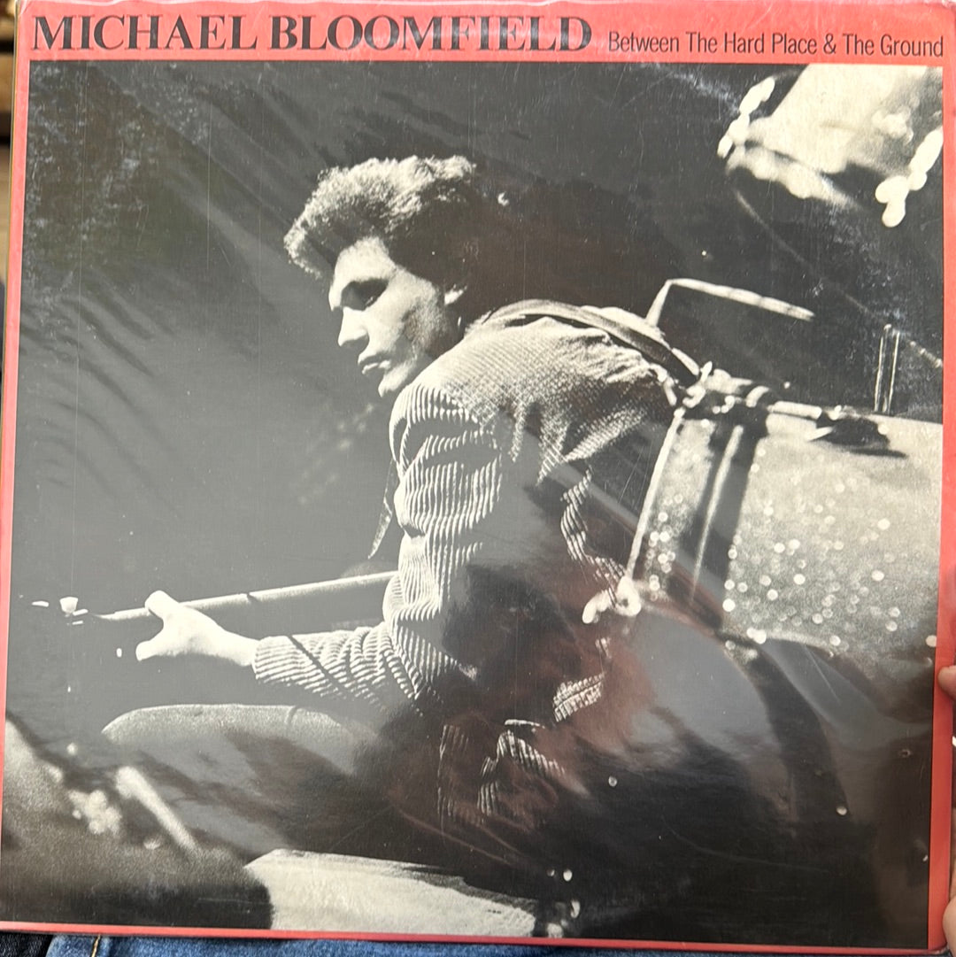 BETWEEN THE HARD PLACE & THE GROUND Michael Bloomfield